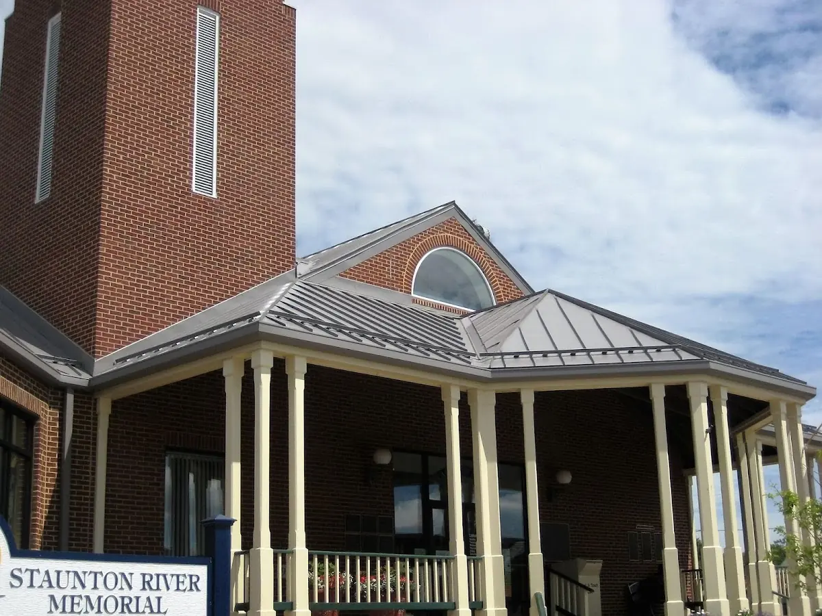 Skilled roofing craftsmen working on a residential roof in St. Anthony
